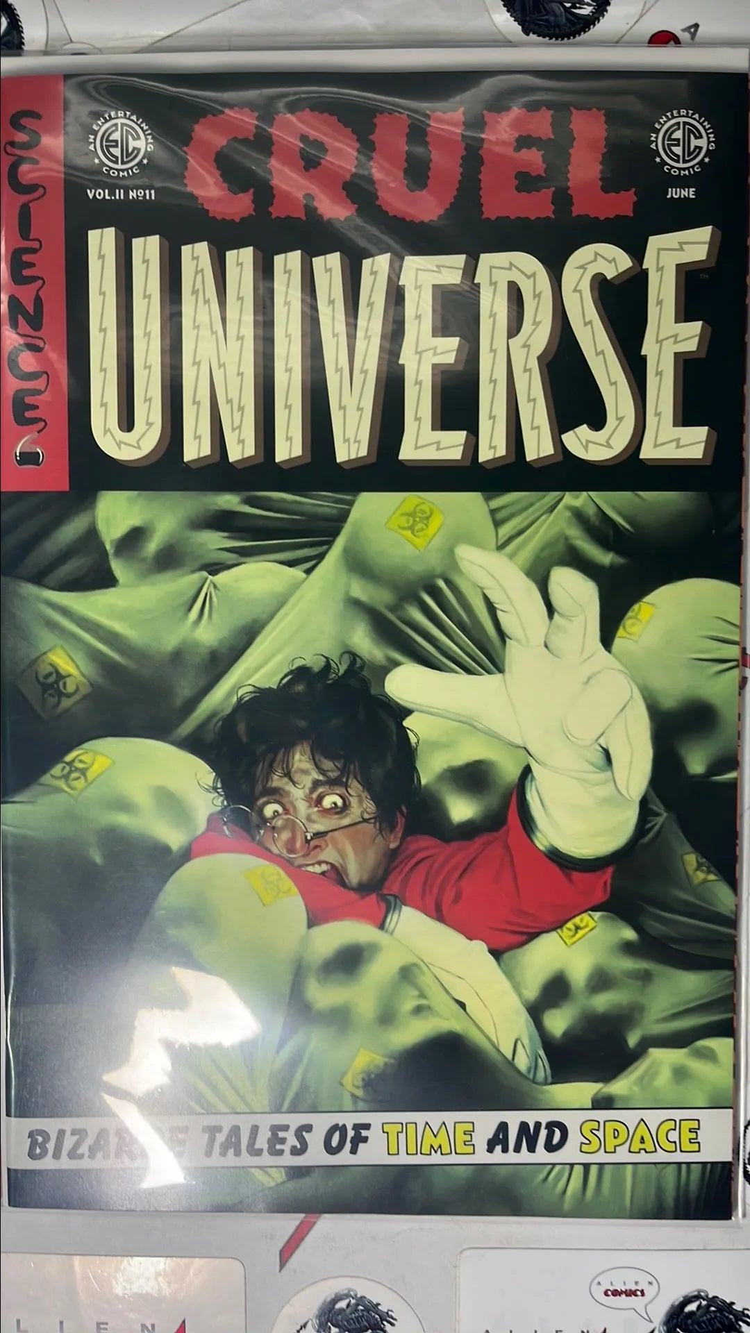 Cruel Universe (#11 EC/Oni Press 2026 Miguel Mercado Cover Man drowning in pool of biological waste corpses NM)